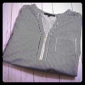 Black and white striped top, with gold zipper